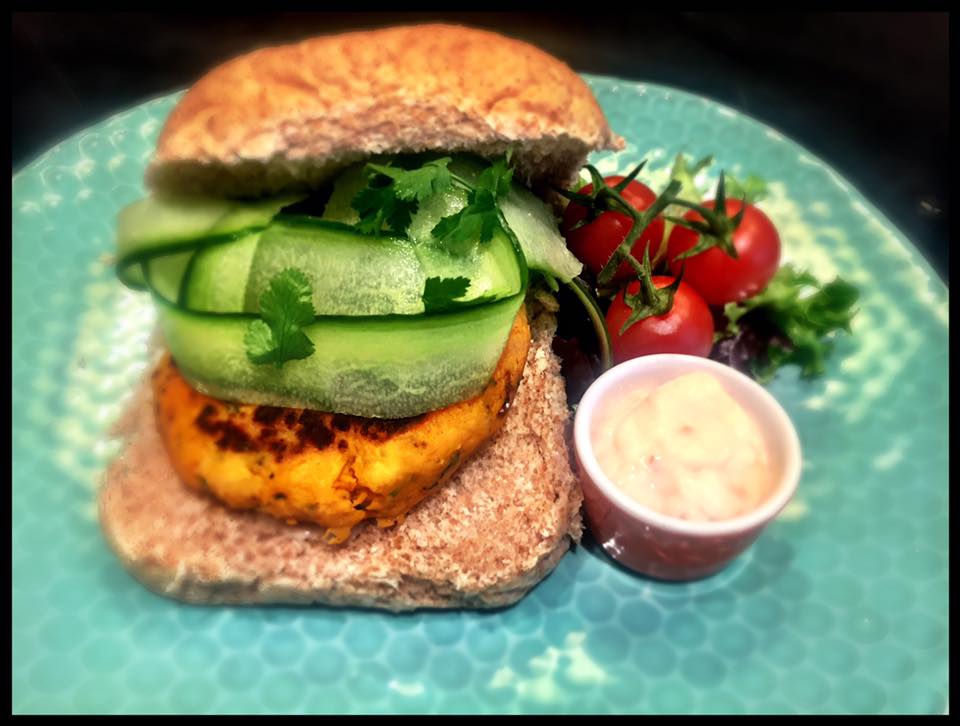 A filled sandwich with salad